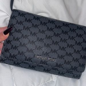 Michael Kors purse/wallet looks brand new.